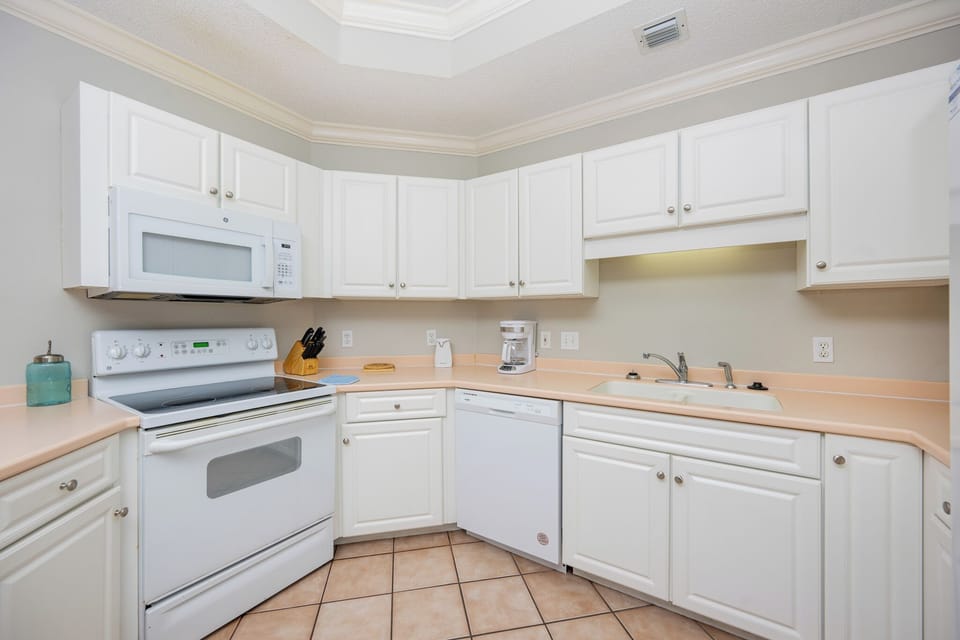 Prepare your favorite meals with ease in this kitchen, enjoying the convenience of a spacious design