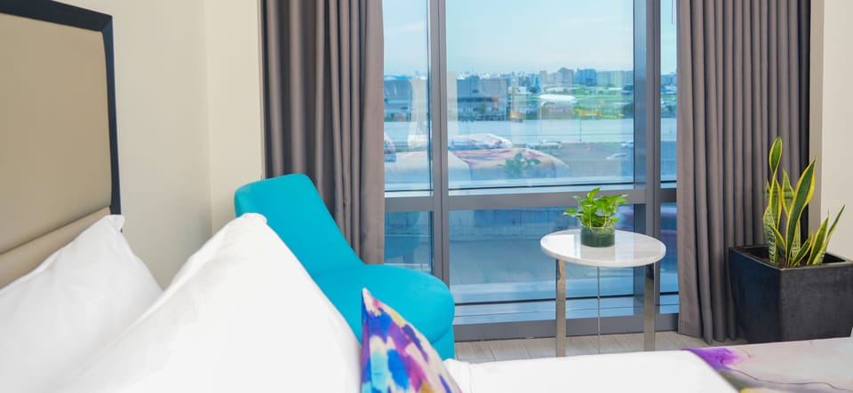Standard Queen with Access to Pool and Gym | Minibar, in-room safe, blackout drapes, free WiFi