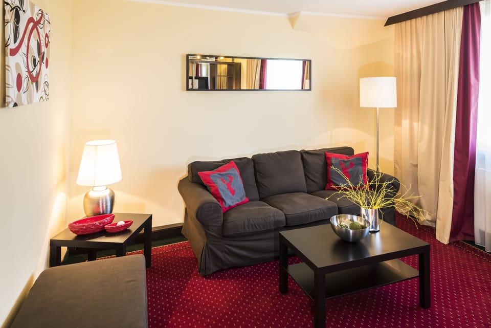 Junior Suite | Living room | Flat-screen TV