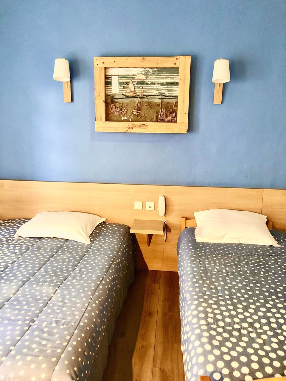 Premium bedding, desk, laptop workspace, blackout drapes
