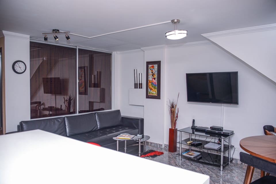 Apartment, 2 Bedrooms | Living area | 32-inch flat-screen TV with cable channels, TV