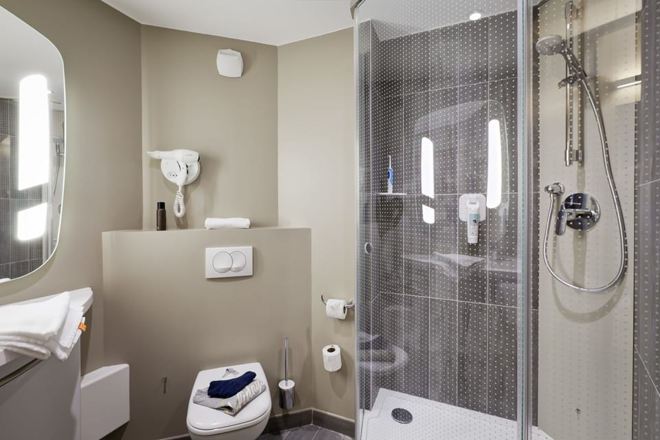 Shower, eco-friendly toiletries, hair dryer, towels