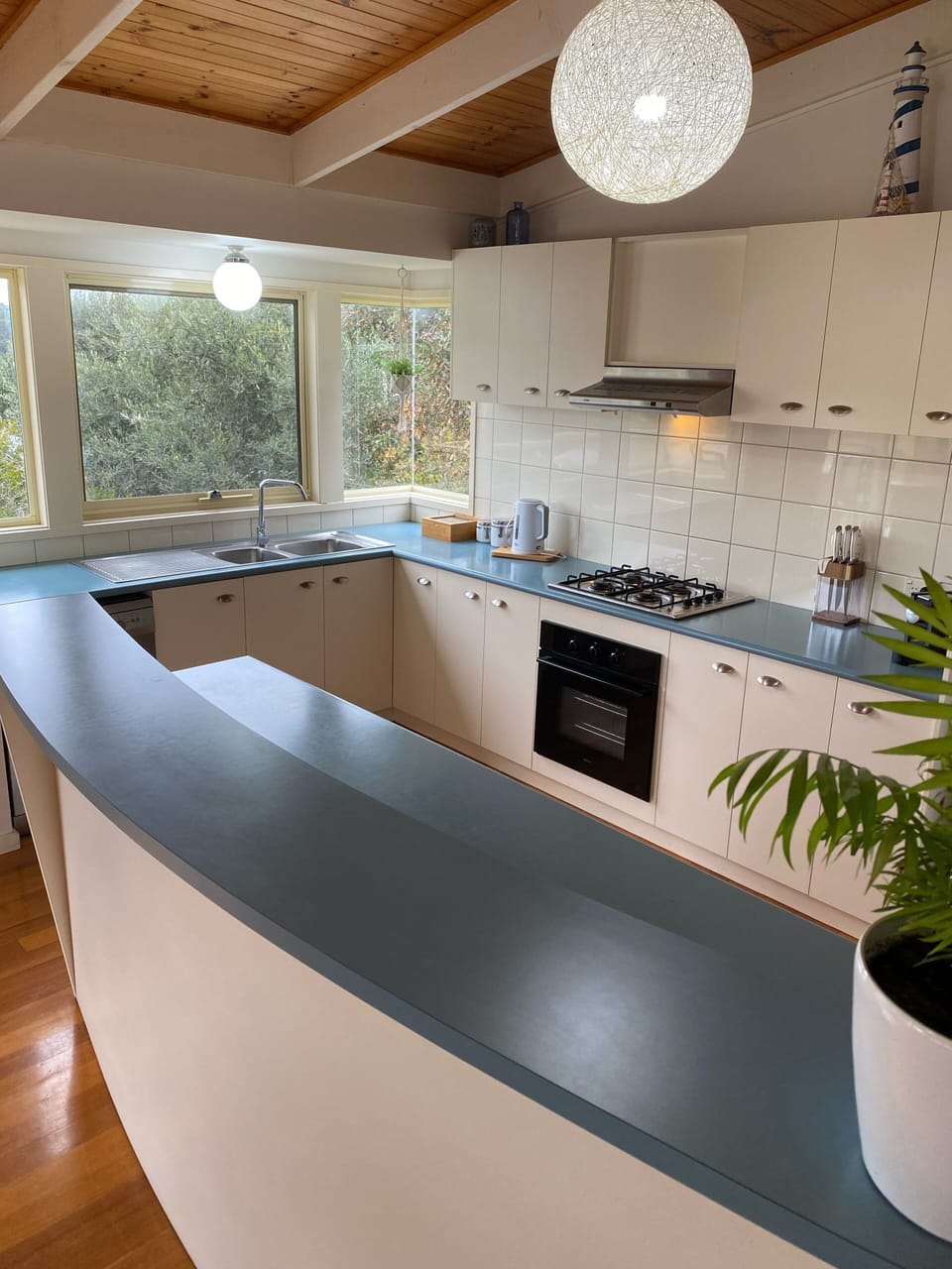 Kitchen with stainless steel dishwasher, full pantry and coffee pod machine