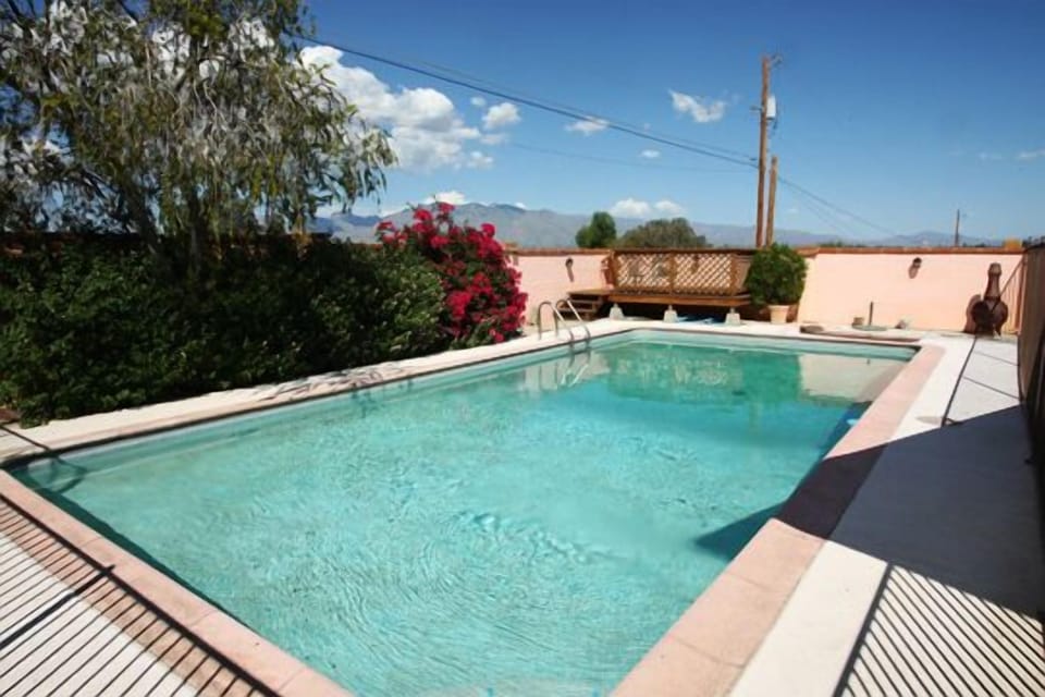 Sparkling Pool with Security Fence and redwood viewing deck. Catalina mountains.