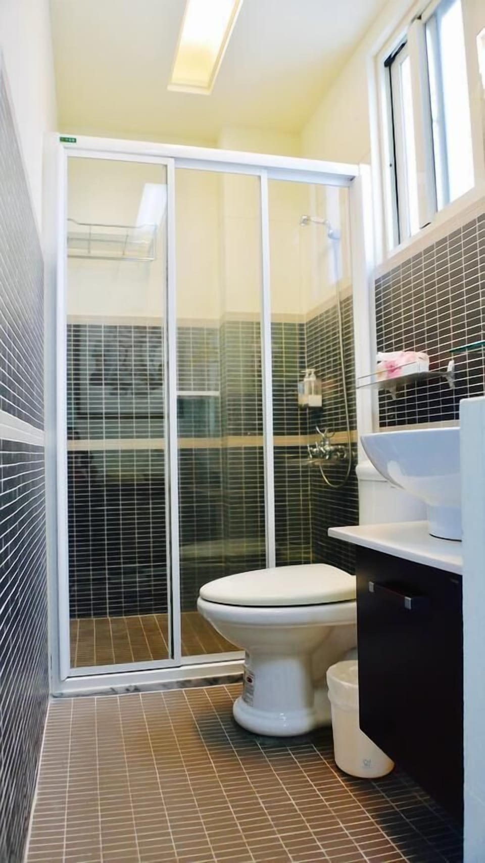 Shower, designer toiletries, hair dryer, slippers