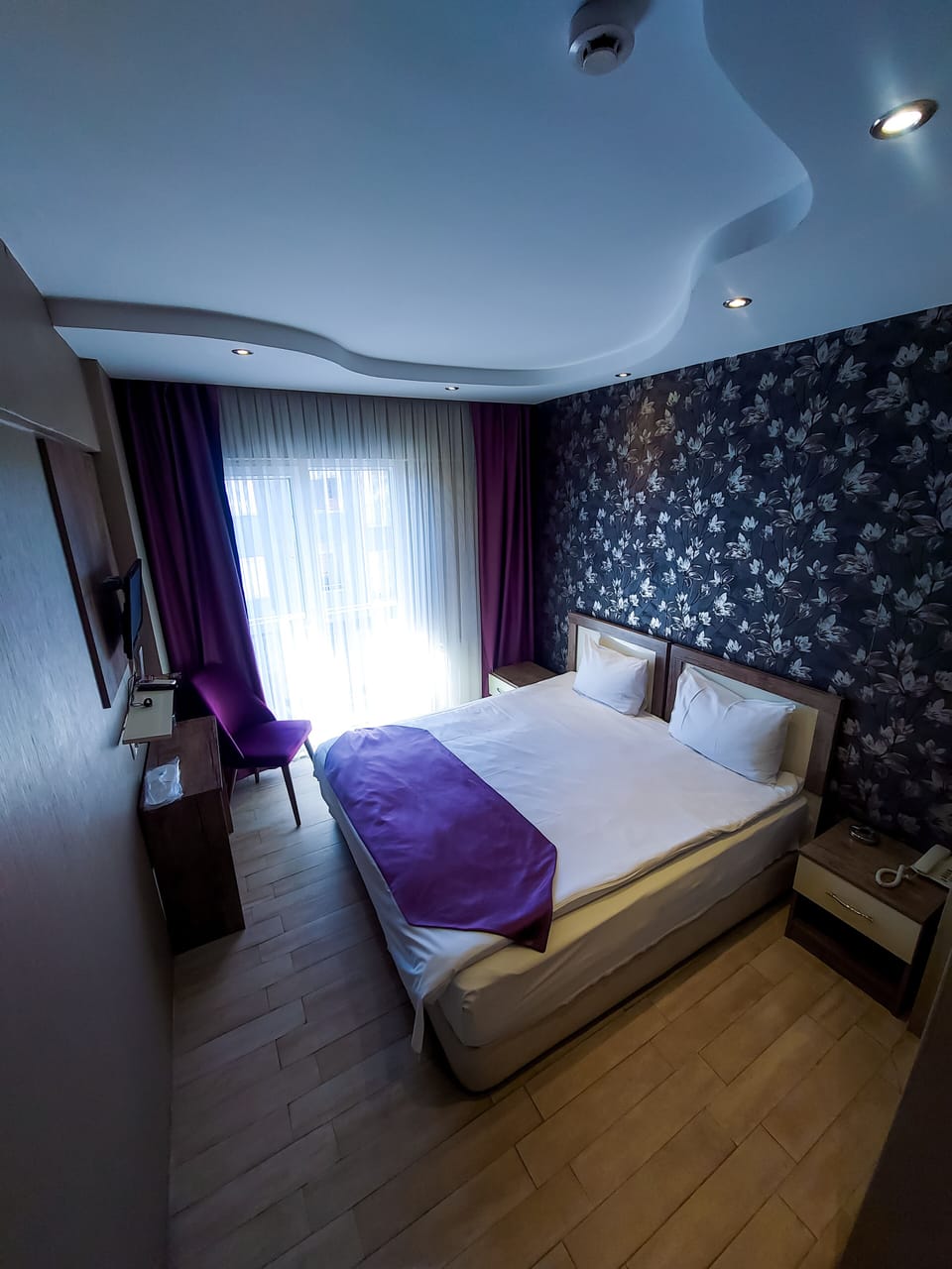 Premium bedding, desk, laptop workspace, soundproofing