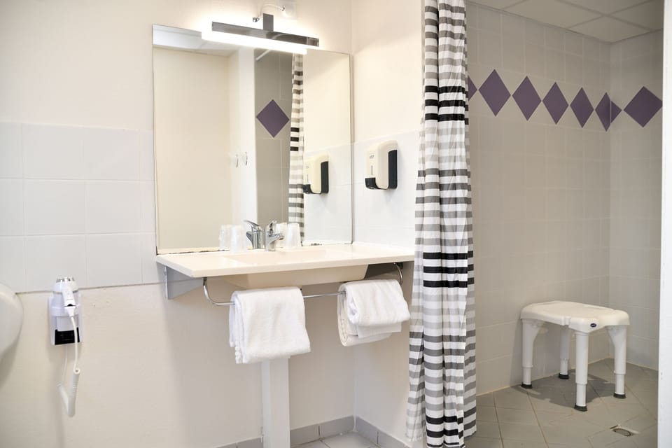 Shower, rainfall showerhead, eco-friendly toiletries, hair dryer