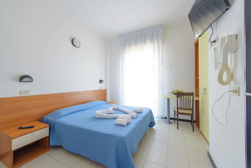 Desk, laptop workspace, free WiFi, bed sheets