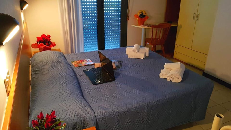 Desk, laptop workspace, free WiFi, bed sheets