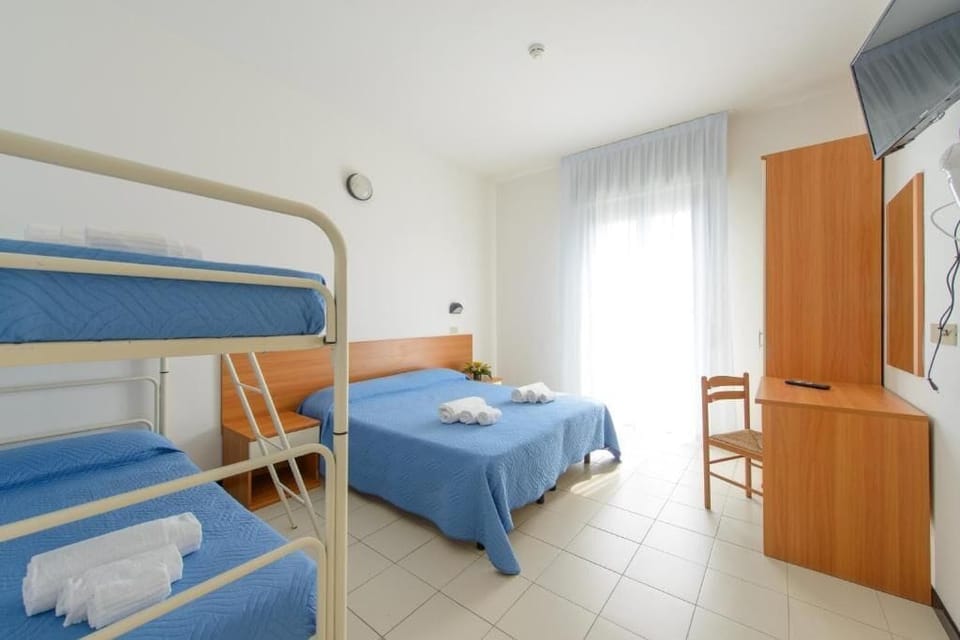 Economy Quadruple Room, Balcony | Desk, laptop workspace, free WiFi, bed sheets