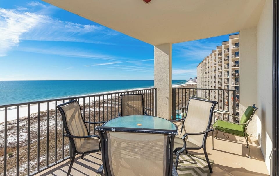 Balcony seating offers a serene view of the beach and gulf, perfect for enjoying morning coffee or sunset evenings