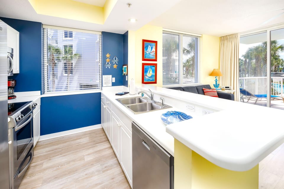 Nicely spaced kitchen, well equipped, has pantry shelves, grilling tools