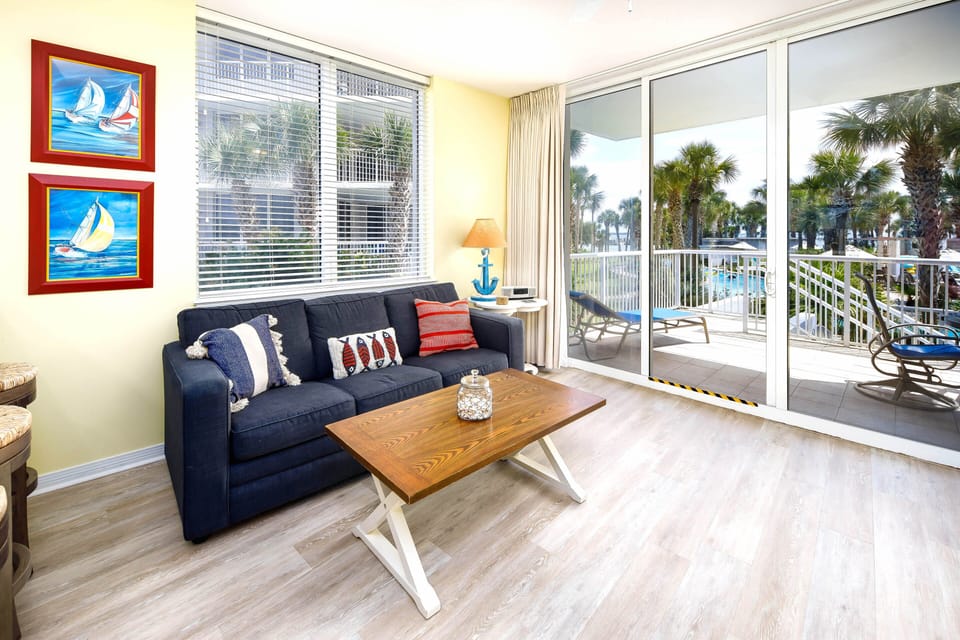 This sunny living space complete with sleeper sofa now has a cozy nautical rug. 