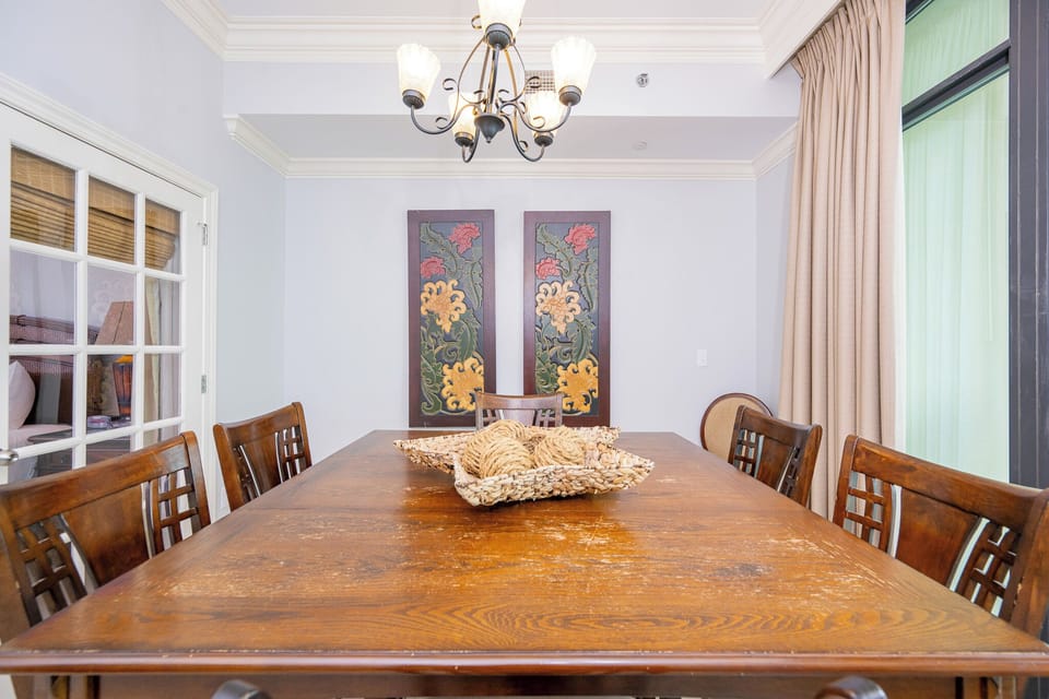 Gather around the rustic dining table, sharing laughter as you enjoy heartwarming moments together