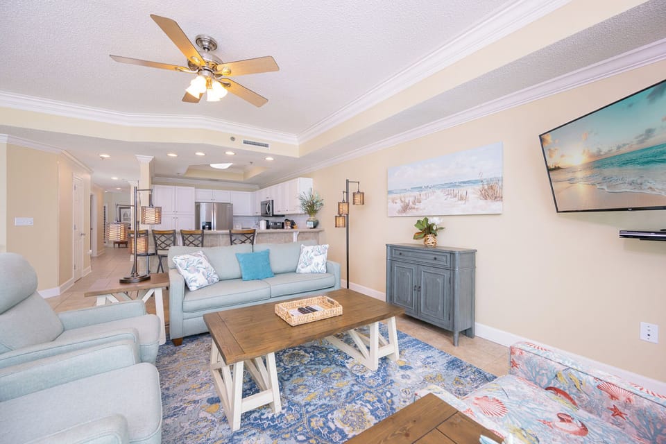 Relax in this living space featuring a cozy sofa with a queen sleeper