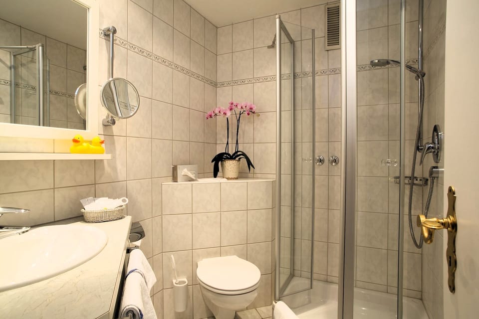 Eco-friendly toiletries, hair dryer, bathrobes, slippers