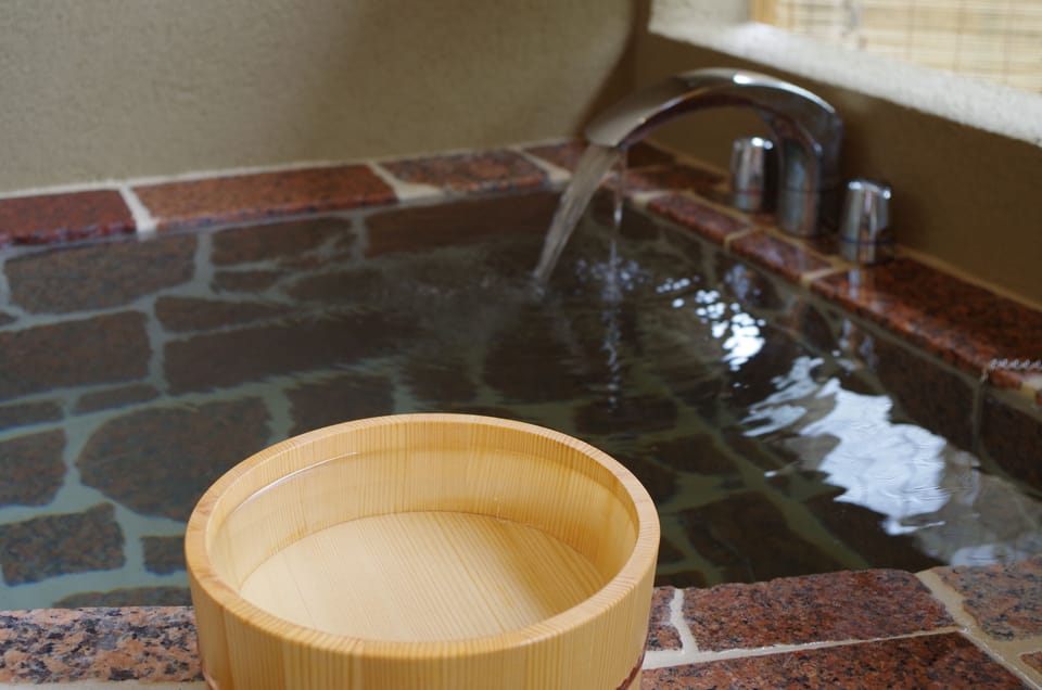 Japanese Style Room with Hot Springs | Bathroom | Separate tub and shower, free toiletries, hair dryer, slippers