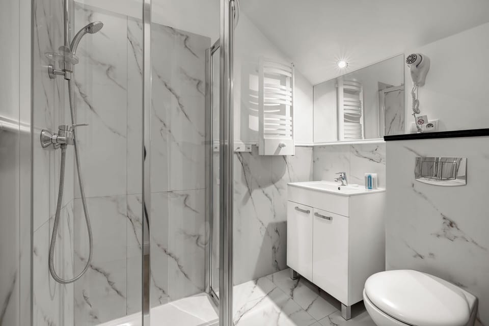 Shower, eco-friendly toiletries, hair dryer, slippers