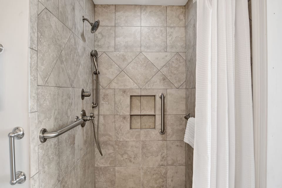 Shower with grab bars in the master bath