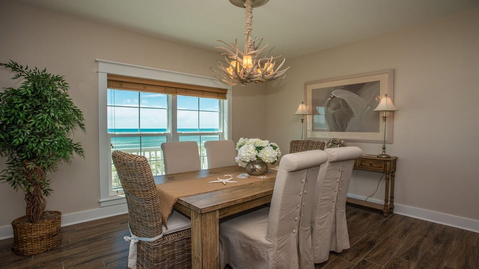 Dining area for 6 with beautiful beach views (another window on left wall).