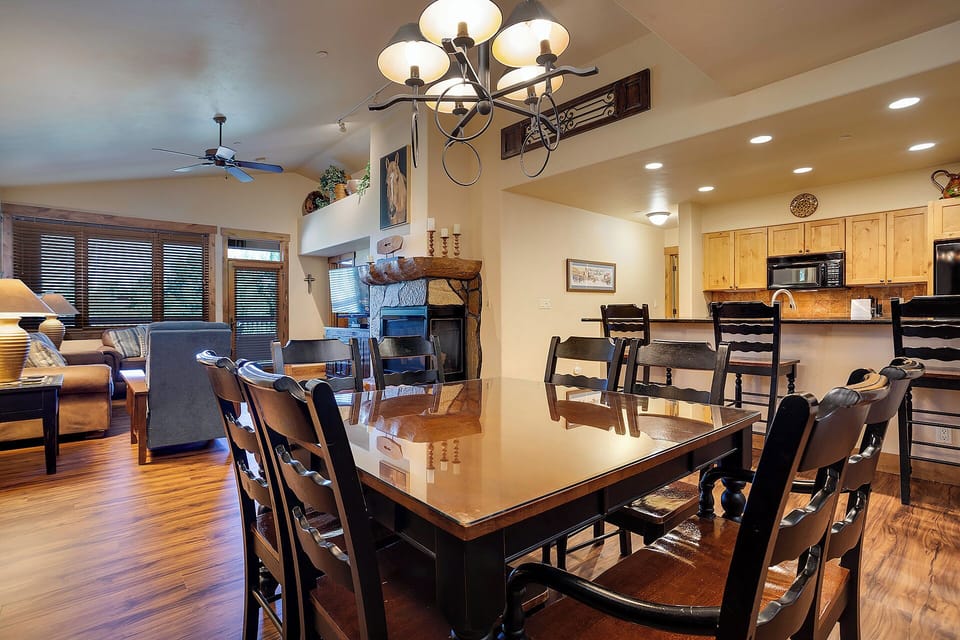 Gather around your spacious dining table for memorable meals with family, while the cozy fireplace creates the perfect atmosphere for lingering conversations.