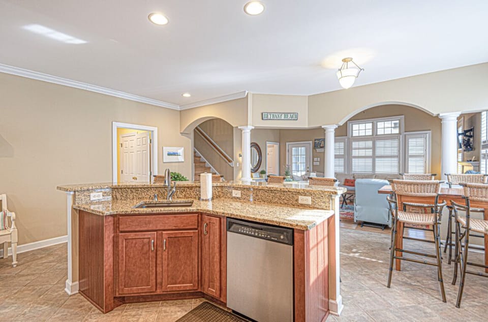 Large island with 4 barstools and separate table with 4 barstools