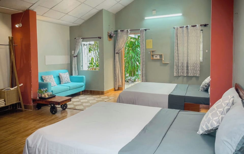 Deluxe Family Room | Desk, blackout drapes, WiFi (free), bed sheets