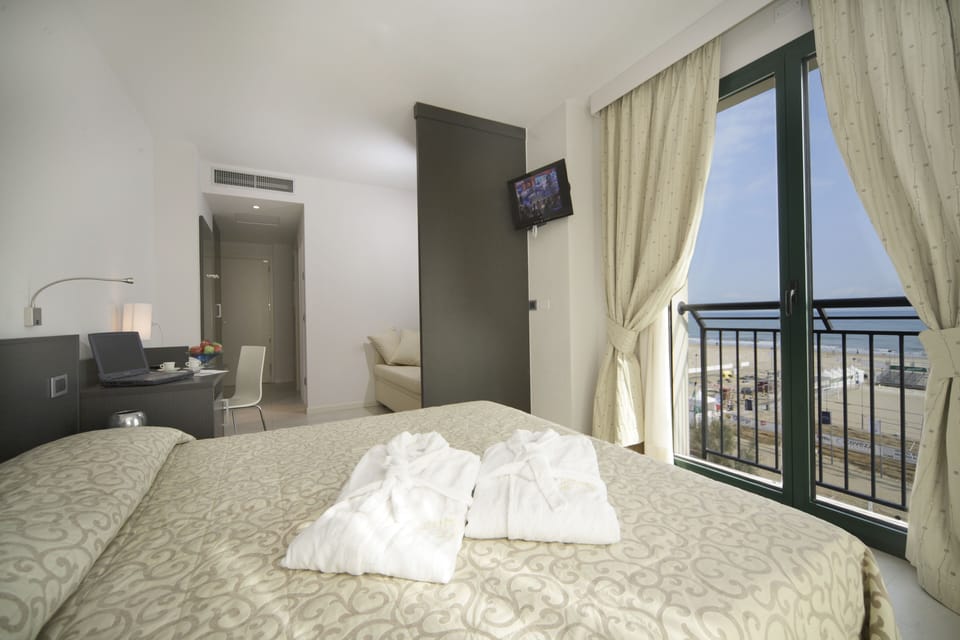 Superior Triple Room, Sea View | Down comforters, minibar, in-room safe, desk