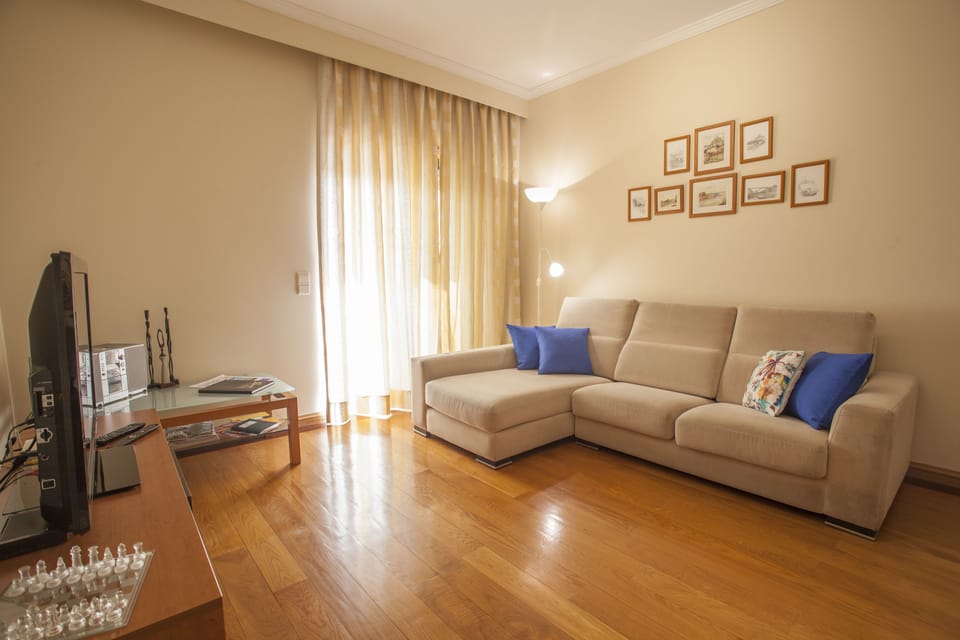 Classic Apartment, 2 Bedrooms, Balcony | Living room | Flat-screen TV