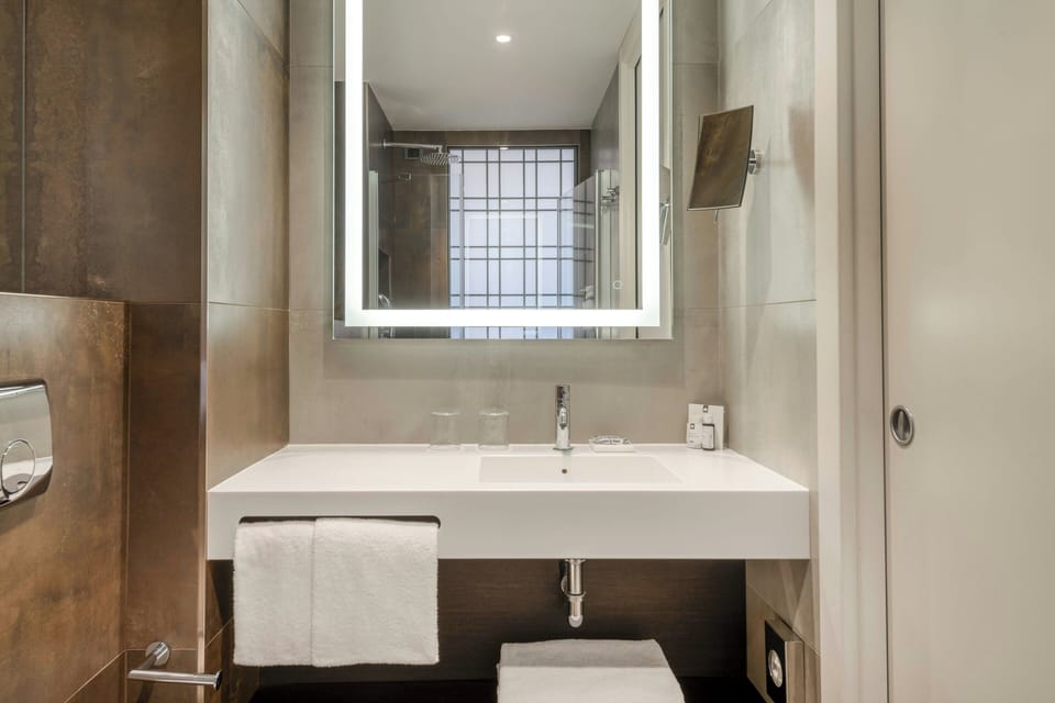Shower, rainfall showerhead, eco-friendly toiletries, hair dryer