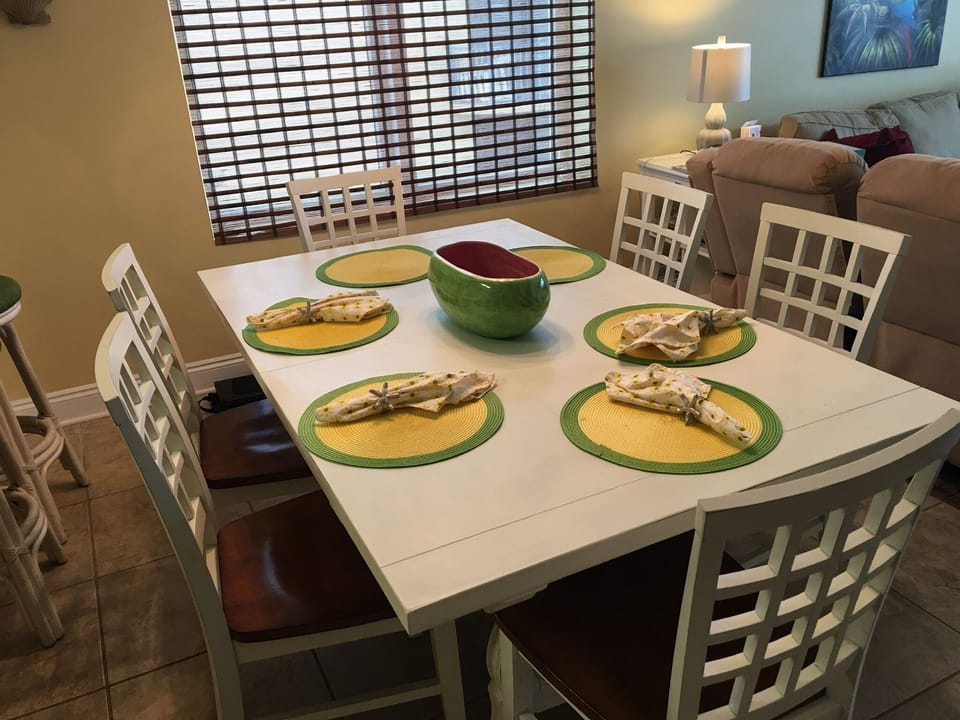 Dining room table with side window. Yellow walls were painted light grey.