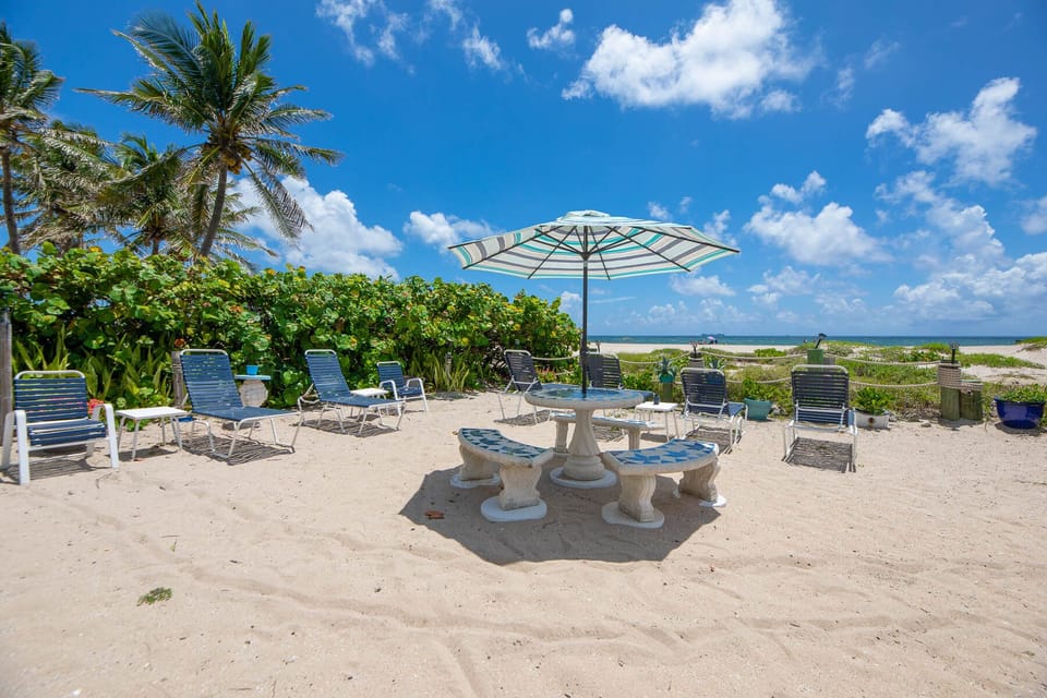 Our private beach area which steps down from our heated pool WITH GRILL