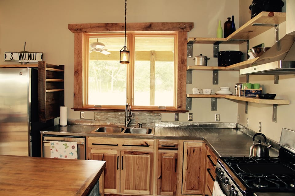 Custom stainless countertops, gas stove, dishwasher, refrigerator