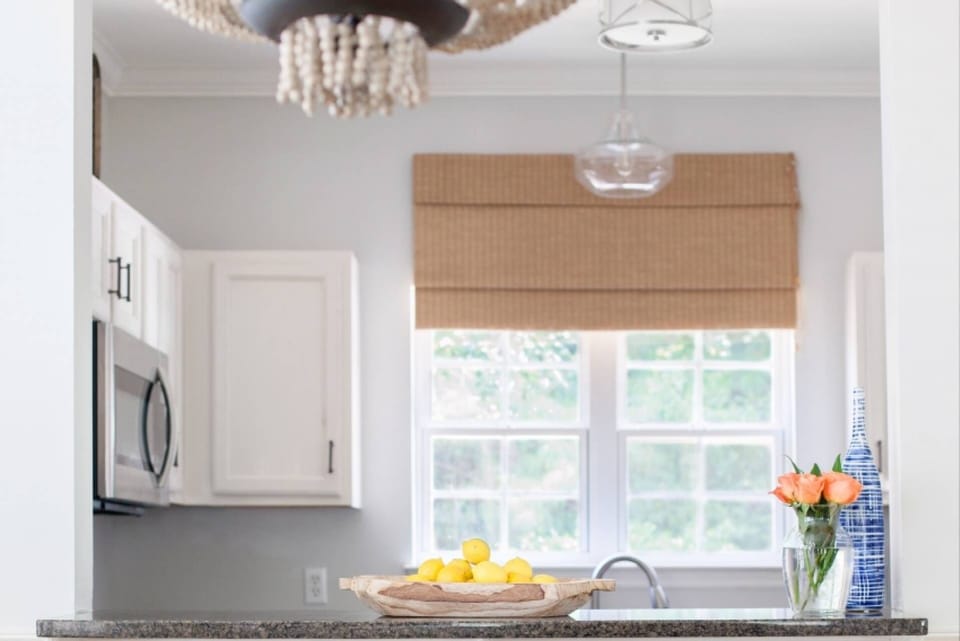 The breakfast bar connects the kitchen to the dining area.