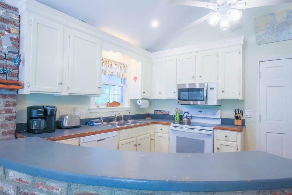There's plenty of room in the kitchen for you and your guests to prepare your meals.