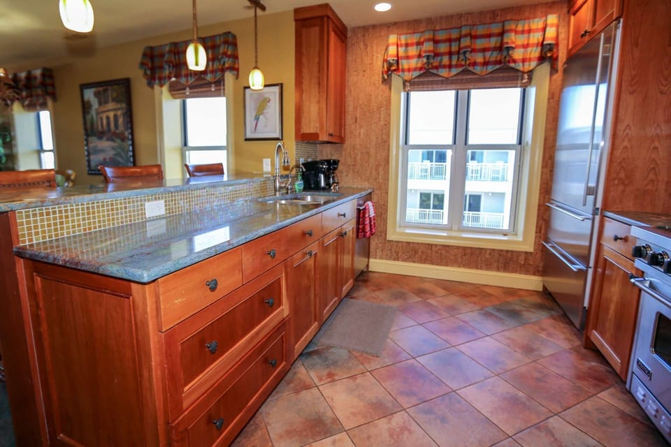 The kitchen features a Viking range and a Sub-Zero refrigerator.