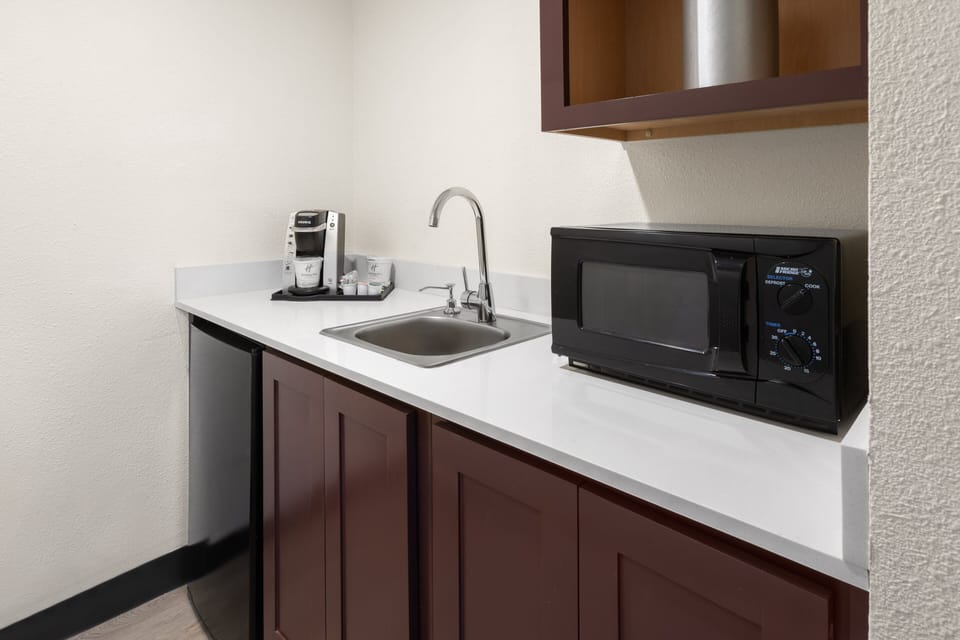 Premium bedding, desk, laptop workspace, iron/ironing board