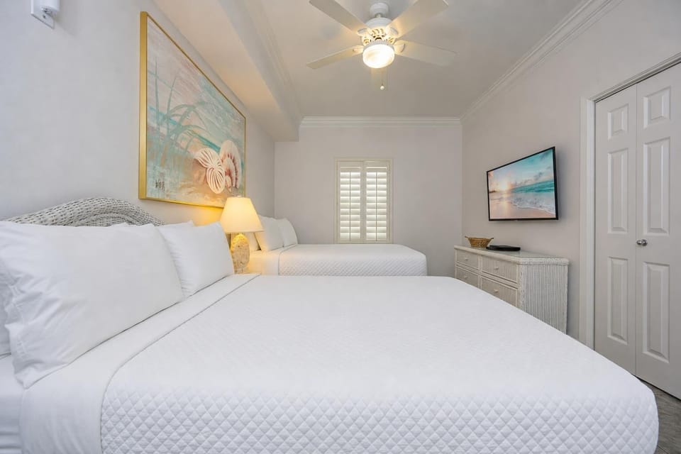 Soft quilts cover two double beds where you rest after lively days spent exploring the shore