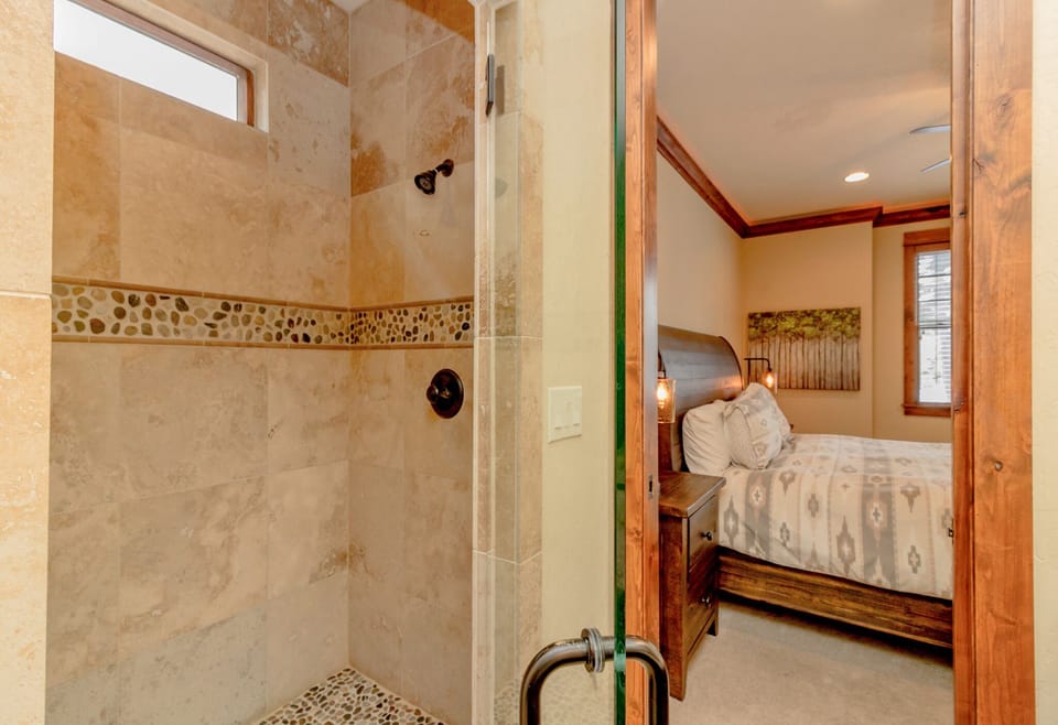 The Dew Drop Inn - Suncadia Resort - Main floor Master Bath with a spa like walk-in tile shower room.