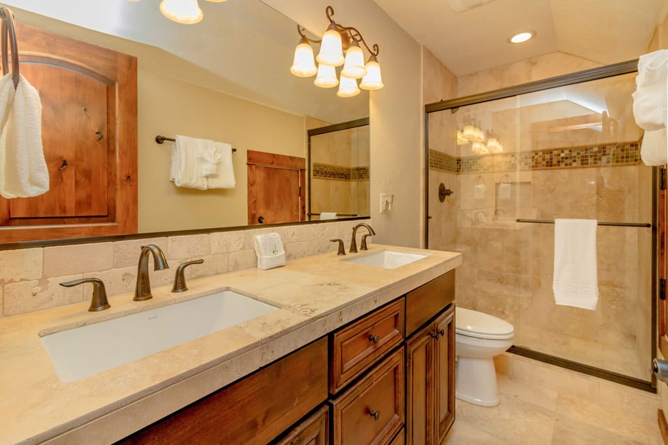 The Dew Drop Inn - Suncadia Resort - 2nd floor Guest Bath with double sinks and a tile shower.