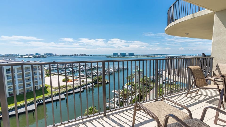 Enjoy breathtaking views of the marina and vibrant blue waters from the relaxing balcony with comfortable seating