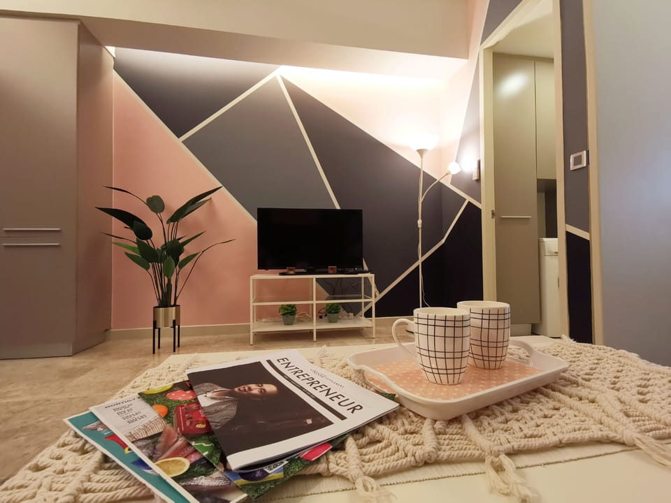 Signature Apartment, 1 Bedroom | Living room | 40-inch LED TV with digital channels, TV, streaming services