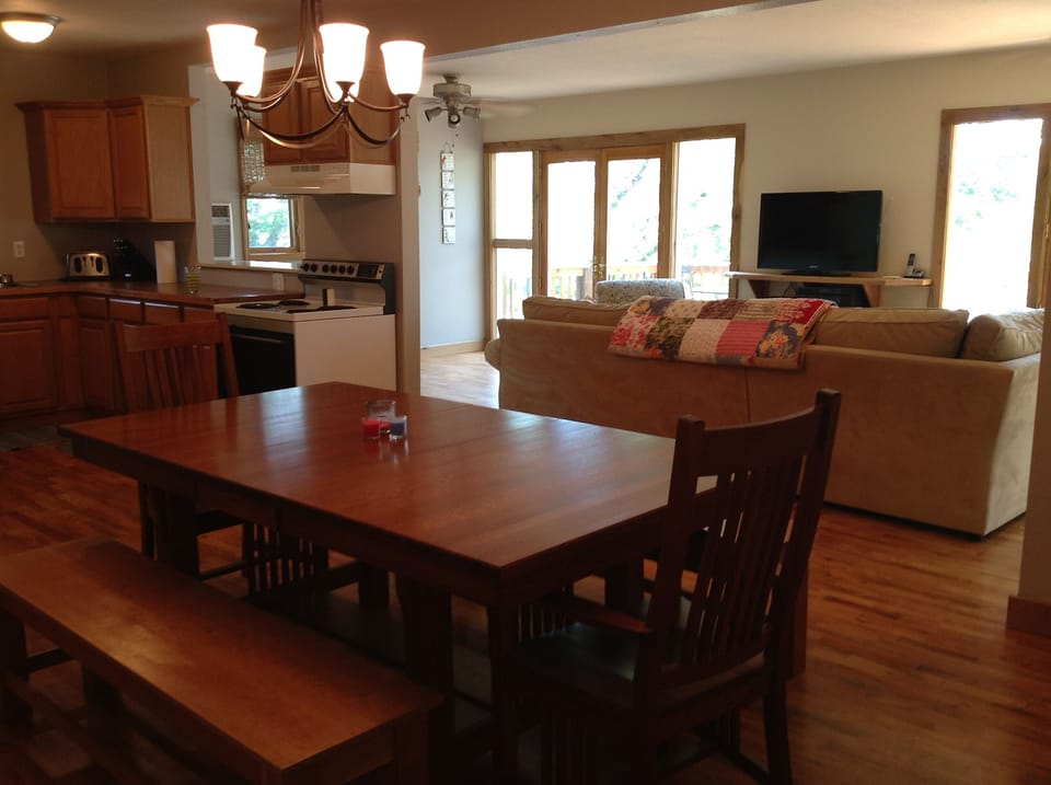 Kitchen & spacious dining table. No dishwasher.  Fire extinguisher on wall.