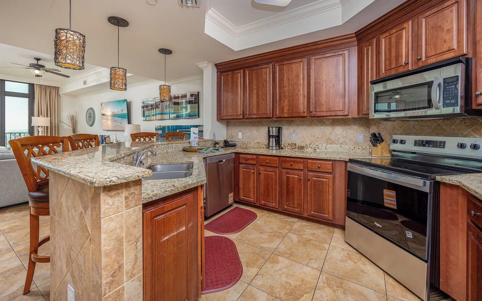 Craft delicious meals together in this inviting kitchen, blending family time with coastal charm