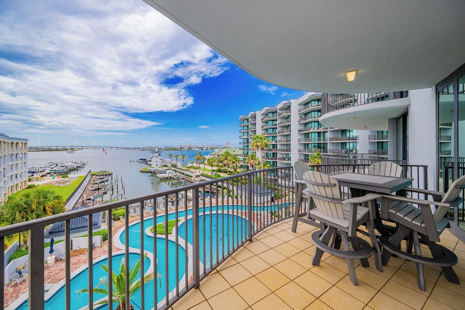 Captivating balcony views of the marina, pool and lazy river area, perfect for relaxation and outdoor dining