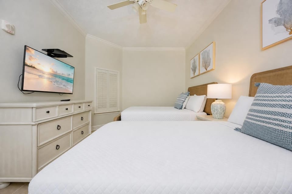 Unwind in this queen guest suite and stream your favorite shows or enjoy a good movie after a beach day