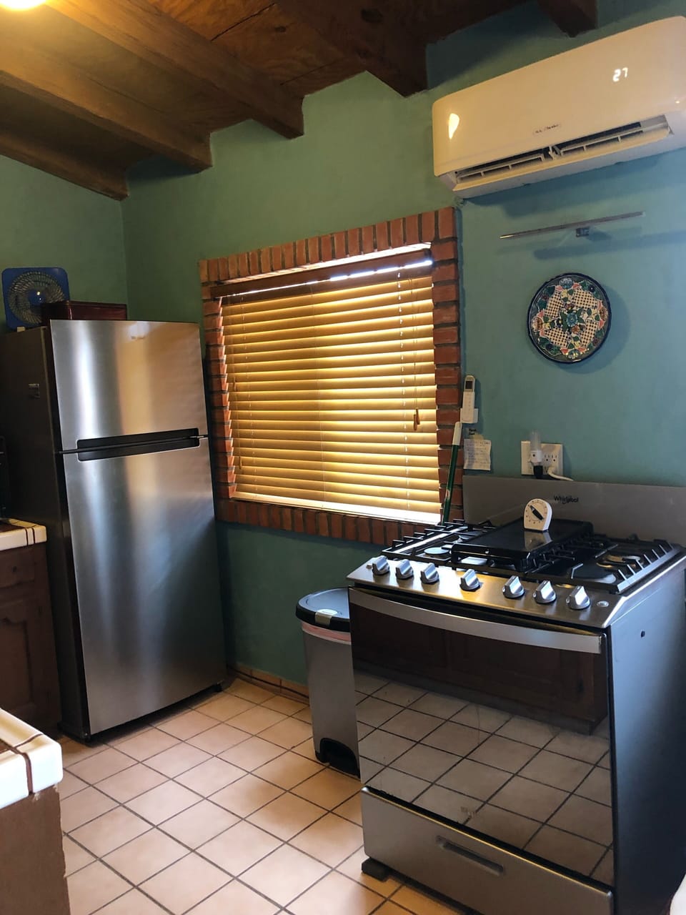 Kitchen with new refrigerator, stove and mini split a/c, heater