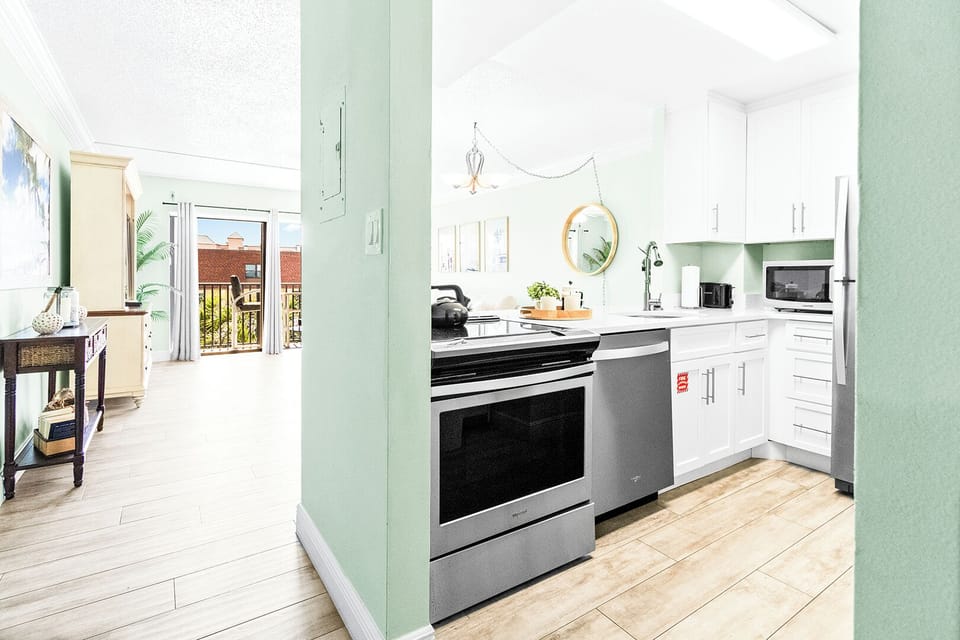 Sleek and modern kitchen with stainless steel appliances and ample counter space.