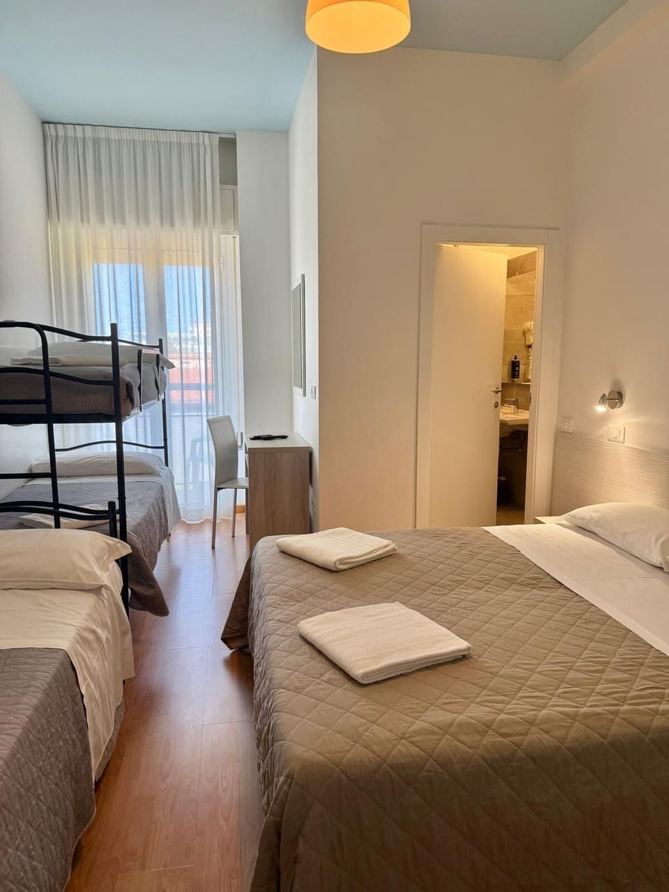 Family Room | Frette Italian sheets, premium bedding, memory foam beds, desk