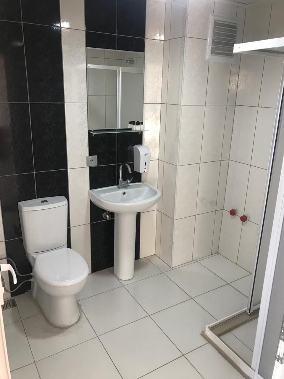 Shower, bathrobes, slippers, towels